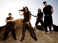 Bullet For My Valentine  The band standing on a sand dune.